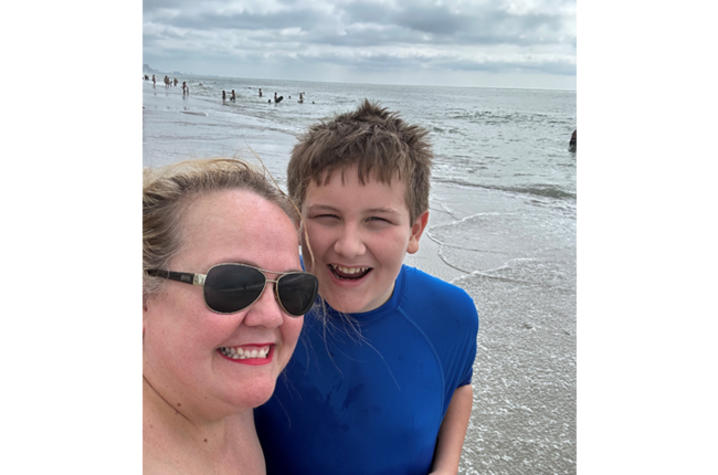 image of Lori and son Henry on the beach
