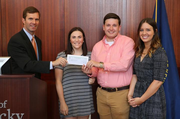 photo of Postel, students and Attorney General Andy Beshear