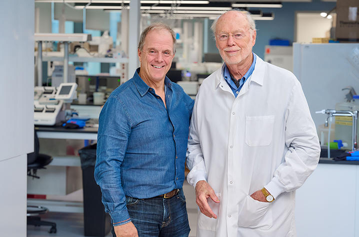 Director Bill Haney and scientist Phil Sharp pose in lab
