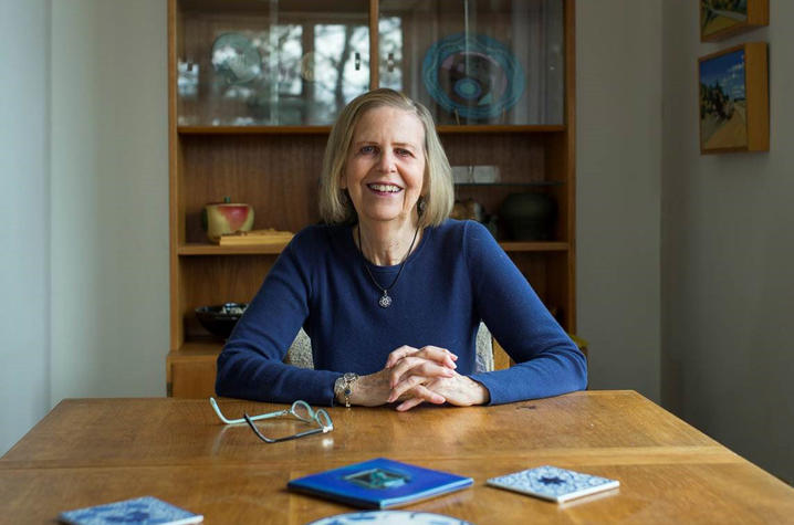 photo of Bobbie Ann Mason seated at end of dining table