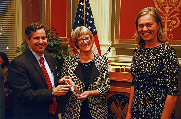 photo of Doug Boyd and Joanna Hay (right) present bourbon documetary to AFC Director Elizabeth Peterson