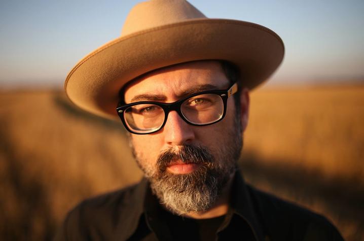 headshot photo of Brett Ratliff in hat