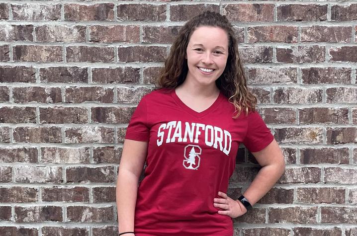 photo of Shelby Rae Buckman in Stanford T-shirt in front of brick wall
