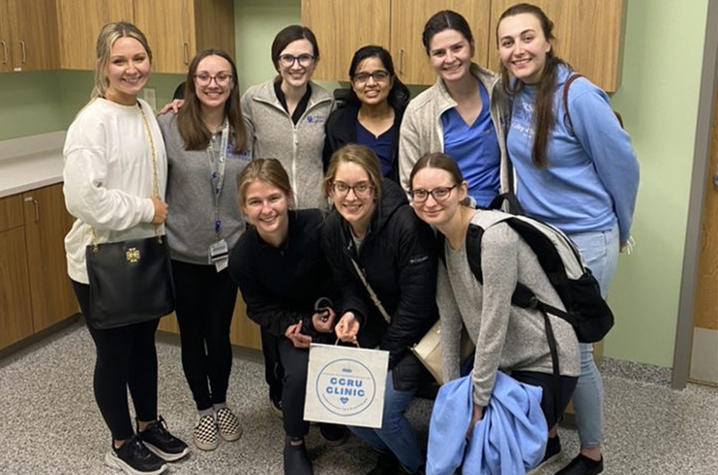 medical students standing together inside of the new clinic