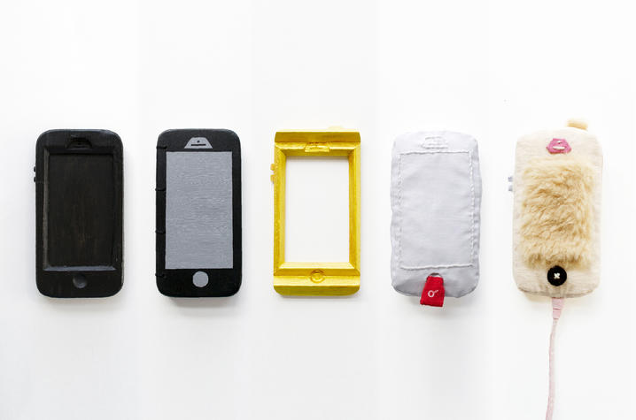 photo of a series of mixed media work in the shape of 5 cell phones titled "With/Without" by Mia Cinelli