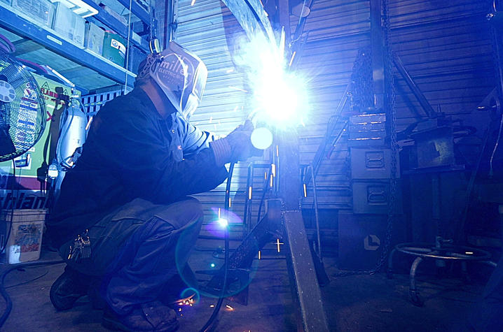 photo of Jeremy Colbert working on sculpture 