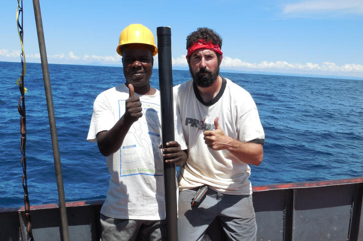 photo of Michael McGlue and M. Mupape recovering core sample