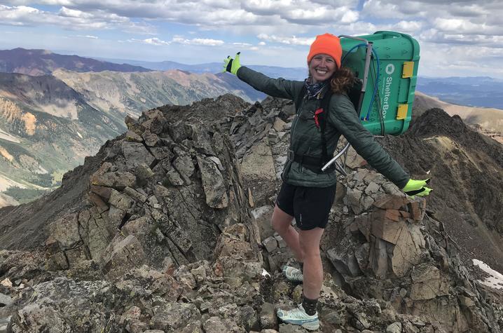 photo of Brittney Woodrum climbing mountain in Colorado
