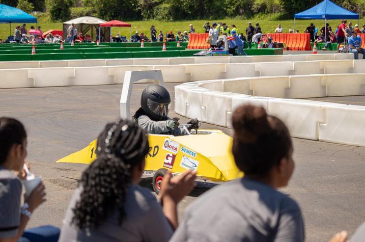 photo of student racing an electric vehicle