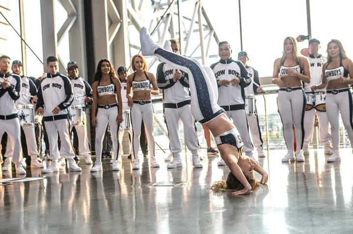 photo of Kristany Setser dancing with Dallas Cowboys Rhythm and Blues team behind her by 