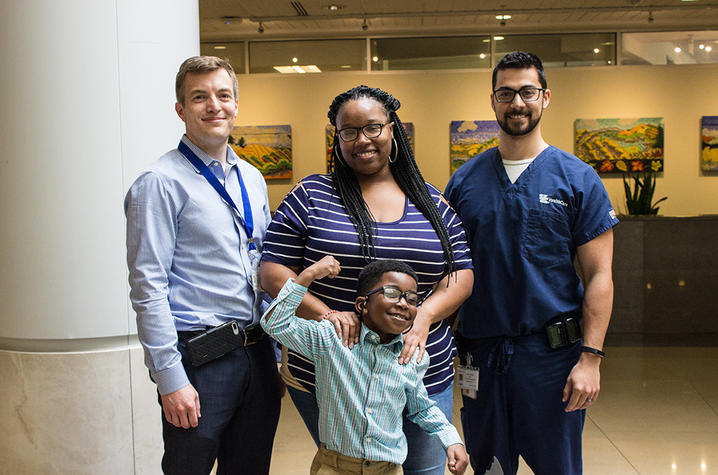 DJ with his mother Keisha and Dr. Brandon Miller and Dr. Chris Spears