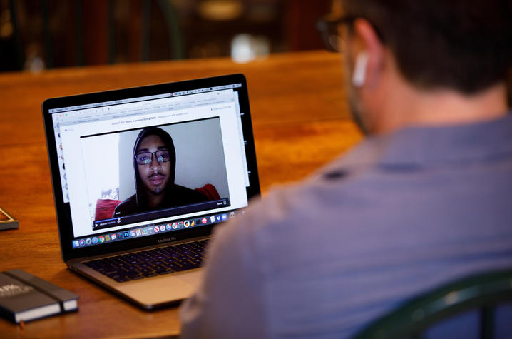 photo of faculty member talking to student via Zoom