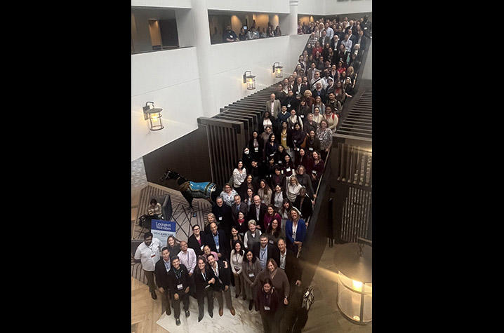 200 attendees of the 2025 NIEHS EHSCC Annual Meeting on the stairs