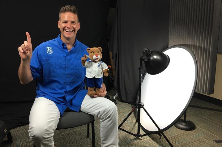 photo of Eric Bumm with Wildcat doll