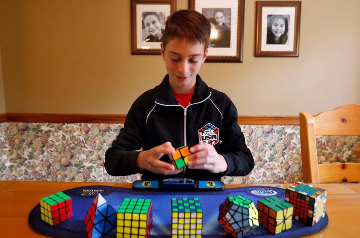 photo of Lucas Etter with cubes