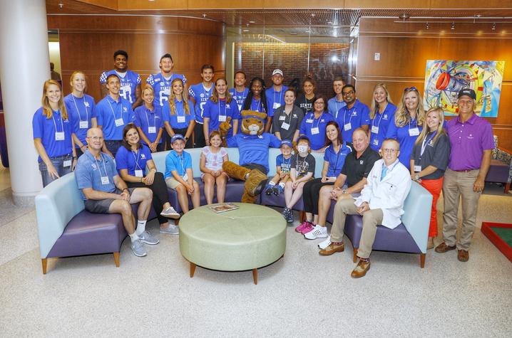 UK student athletes and volunteers cheered on the patients as they putted through a nine-hole course in the children's hospital. 