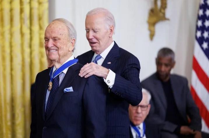 President Joe Biden presents writer and director George Stevens Jr. 