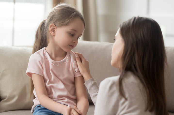 photo of mother comforting daughter