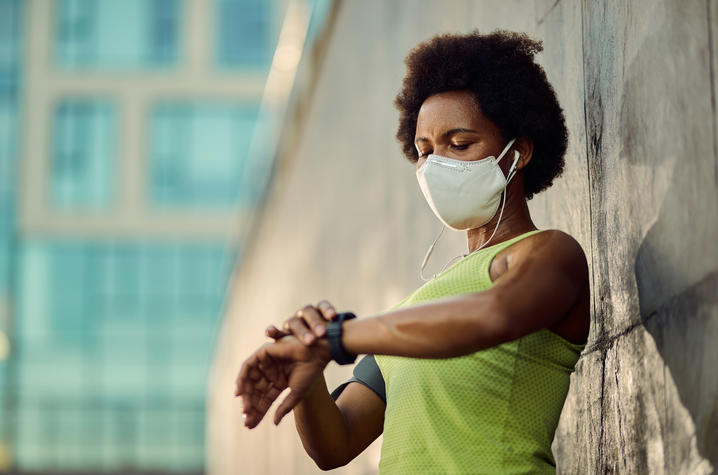 photo of woman wearing smart watch