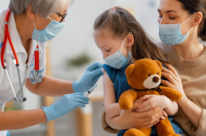 image of young girl getting a vaccine