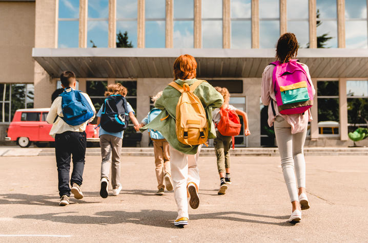 photo of kids running to school