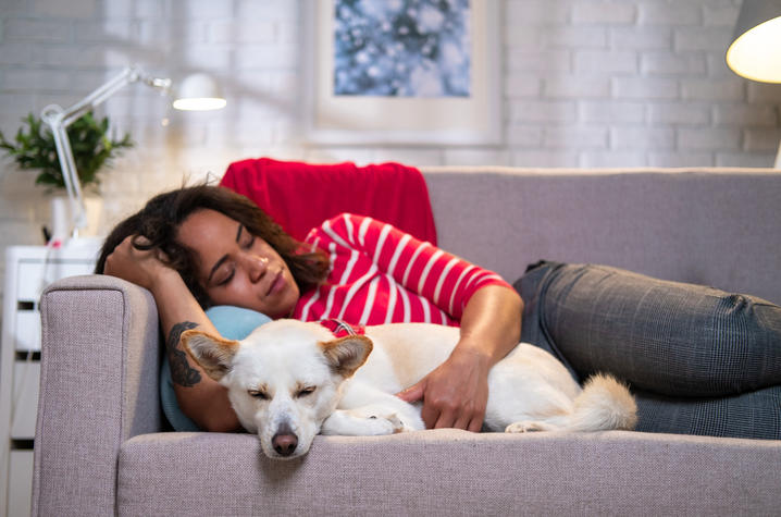 dog and woman napping