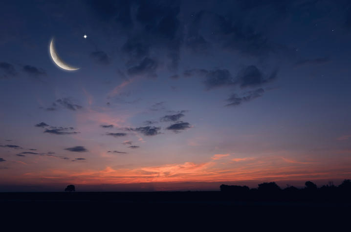 photo of night sky with moon and star
