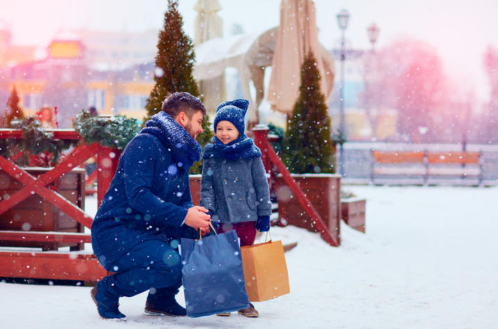 dad and son shopping in snow