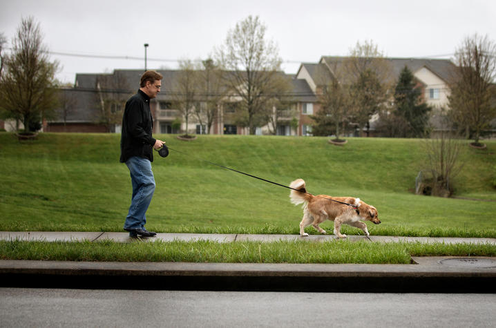 Photo of Gregg Whitaker walking his dog Gracie. Mark Cornelison | UK Photo
