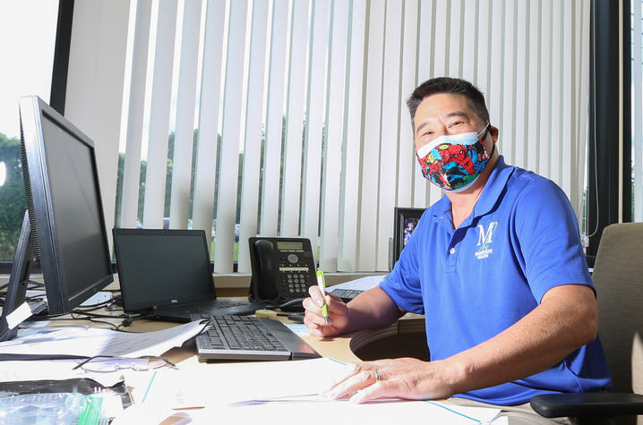 Michael Huang at his desk at Marathon. 