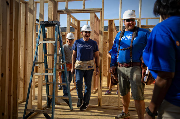 photo showing: Left to Right: Eric Monday, executive vice president for Finance & Administration, UK President Eli Capilouto, Peter Carew, Lexington Habitat for Humanity Director of Construction