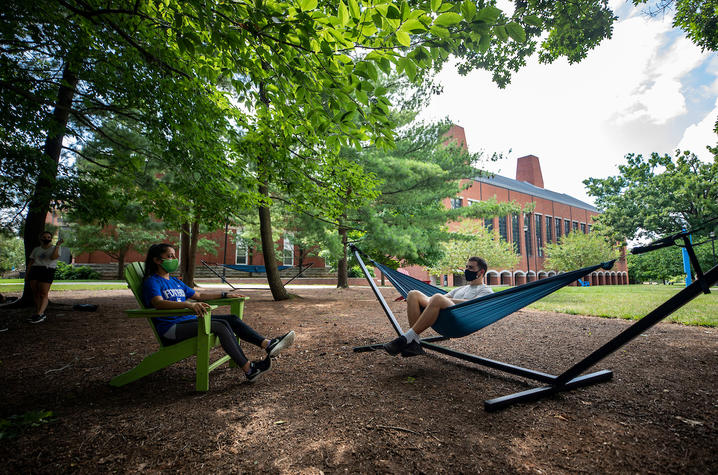 students enjoying one of the hammock gardens on campus