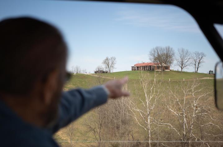 Howard Galbreath riding around his farm