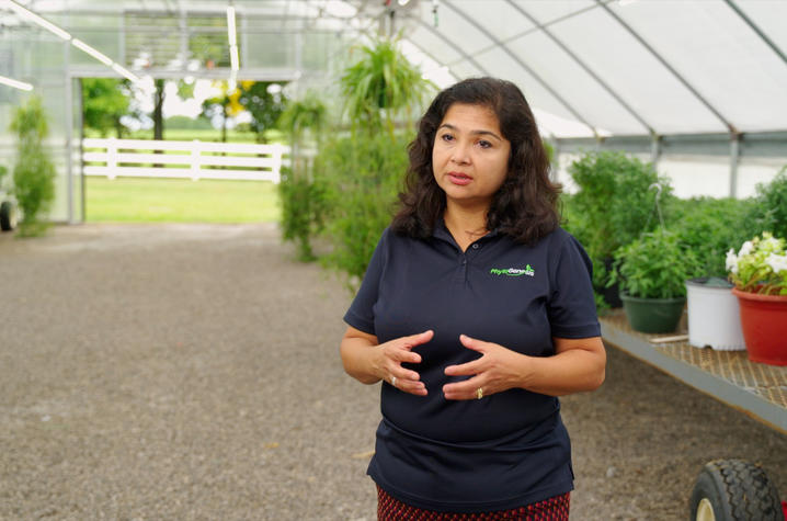Aardra Kachroo in a greenhouse