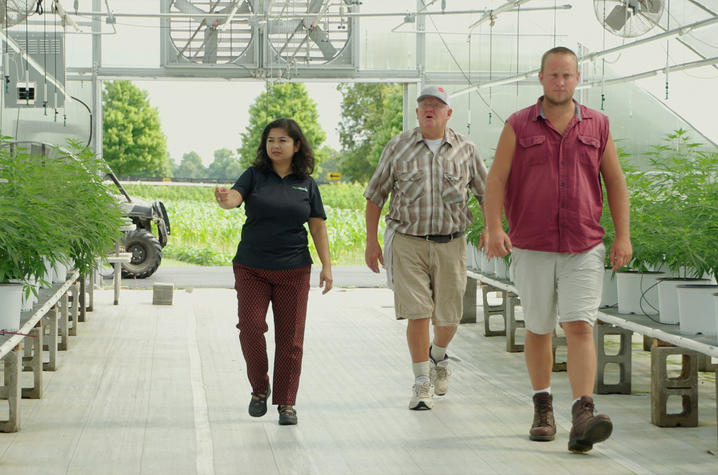 Aardra Kachroo, Philip Wells and Jacob Gariepy in a greenhouse