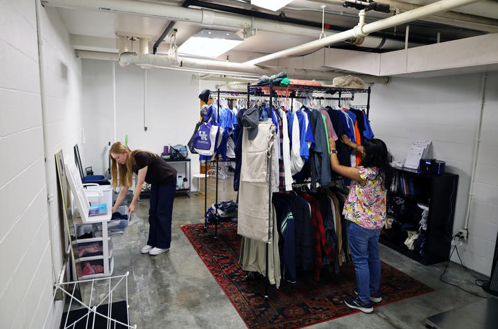 Olivia Smith, a natural resources and environmental science senior, and Nikki Shah, an accounting freshman, sort and display items at The Thrifty Cat, the new campus free store.