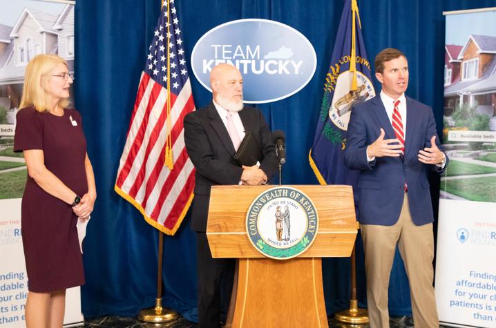 image of Terry Bunn, Eric Friedlander and Governor Andy Beshear answering questions at podium