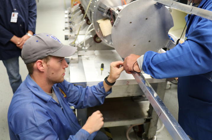 Photo of Devin Sparks integrating UK payload inside the rocket at NASA Wallops.