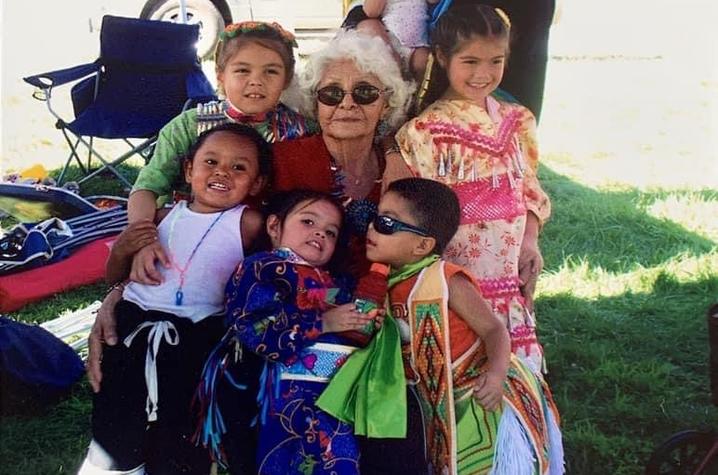 Nana with all of her great grand children in their regalia at a pow wow. (McDarment in pink)