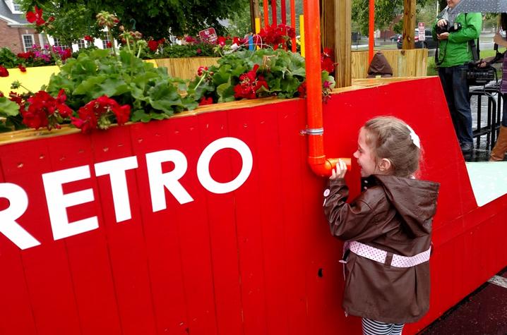 photo of little girl playing at "Music Lounge" pop-up