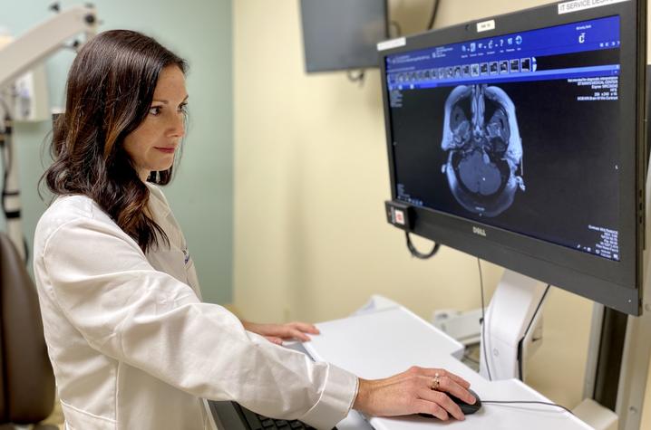 Dr. Beth McNulty, a UK HealthCare neurotologist, looks at a scan. 