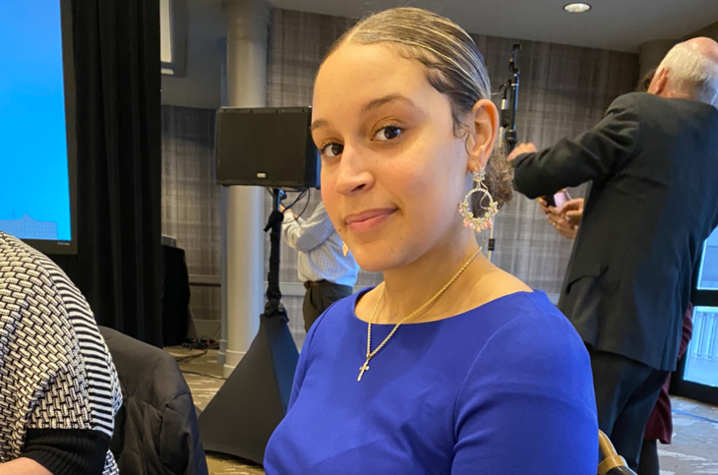 photo of Ashley Wright seated at table at event