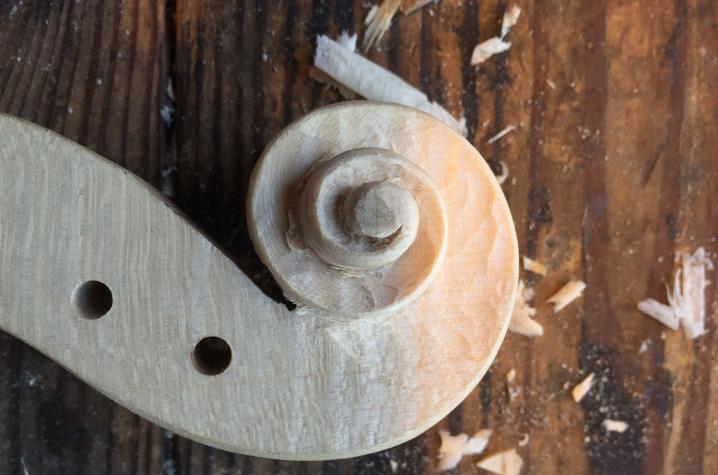 The "scroll" on a violin carved from a single piece of maple