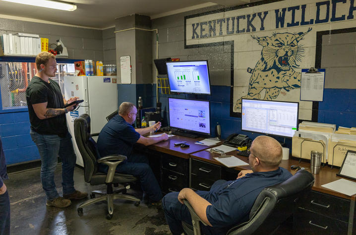 Heating/Cooling Operators, from left, Seth DeBoard, Mike Cummins and Spencer Parker monitor local weather, campus steam output and pressure, and emissions at the Central Heating Plant.