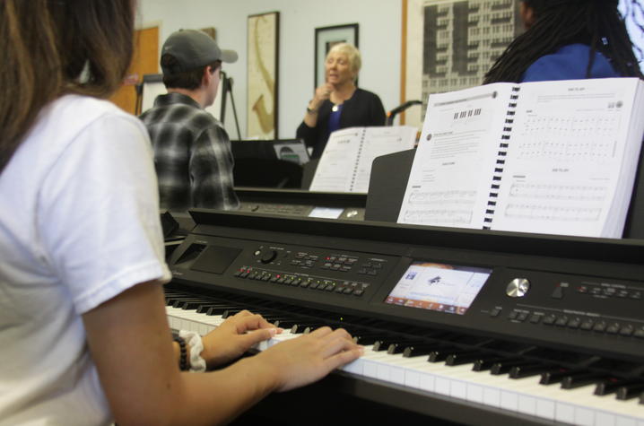 photo of students playing on new keyboards in Vicky McVay class