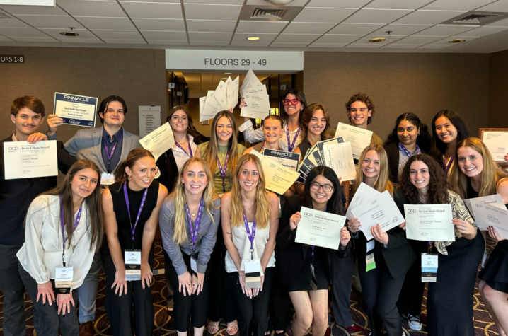 Students standing with their awards. 