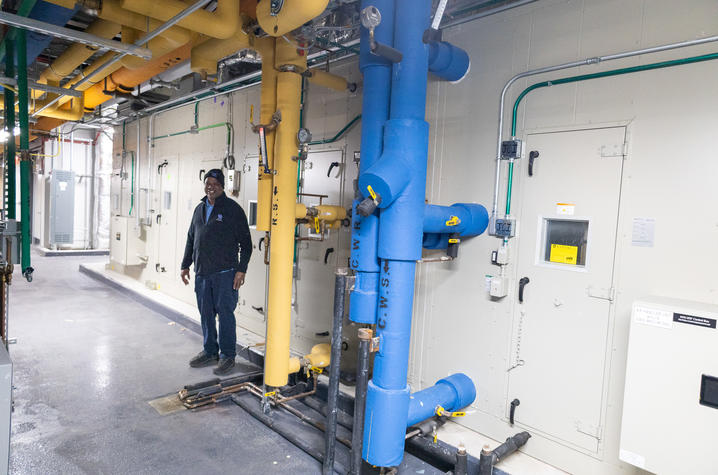 Stephon Holland, maintenance technician, makes sure Air Handling Unit 8, one of the nine in the Jacobs Science Building, is running efficiently.