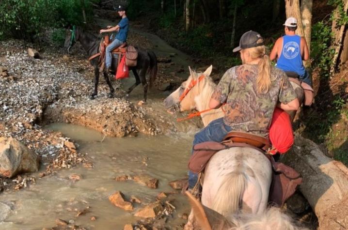 The horseman navigated washed out roads and culverts to reach stranded flood survivors. Photo provided.