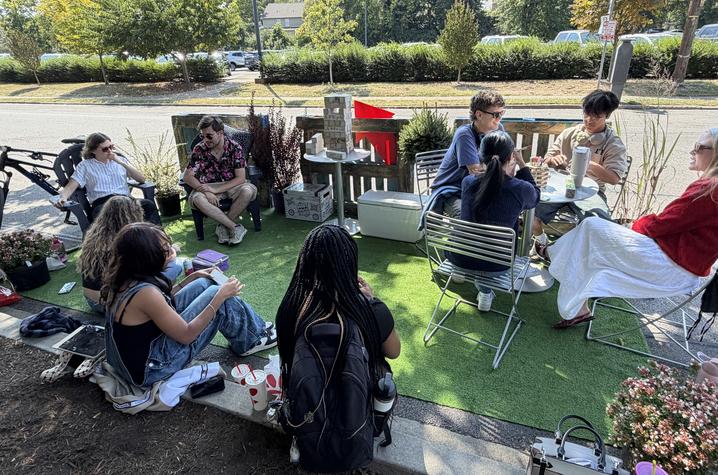 The organizers repurposed chairs and tables from the building and incorporated plants lent by Wilson Plant Company to bring the small space to life.  
