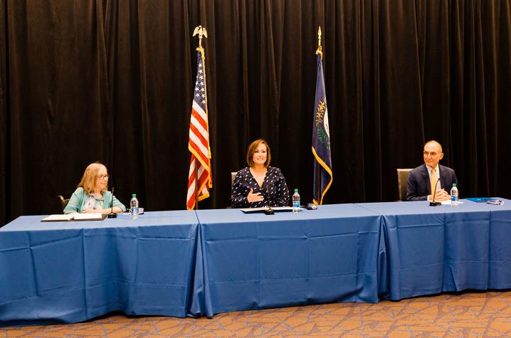 photo of RETAIN news conference speakers left to right: Human Development Institute Executive Director Kathy Sheppard-Jones; Lt. Gov. Jacqueline Coleman; and UK President Eli Capilouto sitting in front of mics at a table